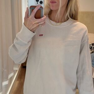 Levi's Women's Light Cream Crew Neck Sweatshirt with Red Logo